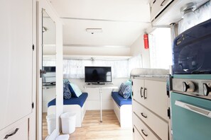 Economy Cabin | Living area | 19-inch flat-screen TV with cable channels, TV