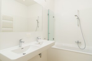 Deluxe Apartment, 2 Bedrooms | Bathroom | Separate bathtub and shower, hair dryer, towels