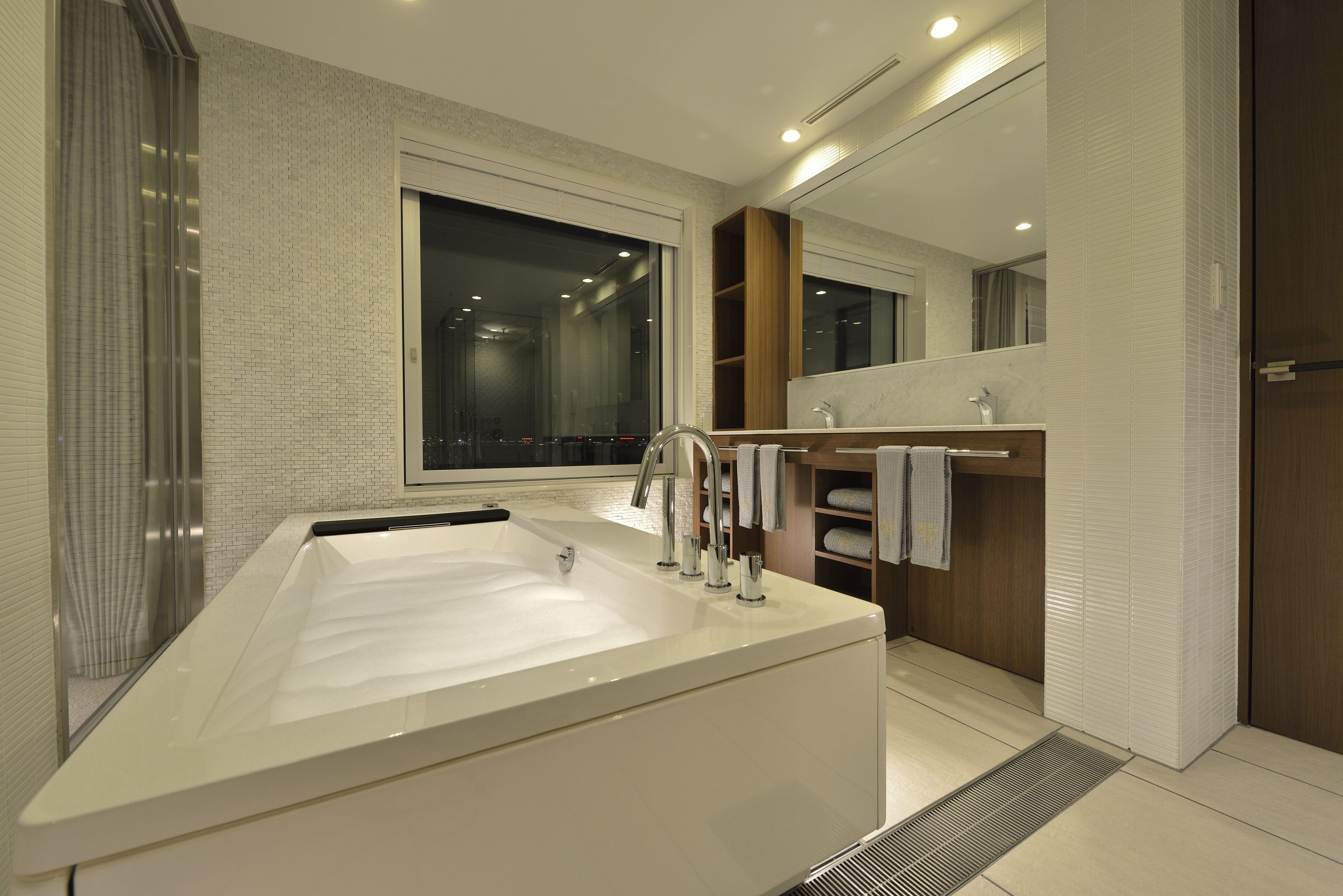 collaboration suite room | bathroom | eco-friendly toiletries, hair dryer, slippers, bidet