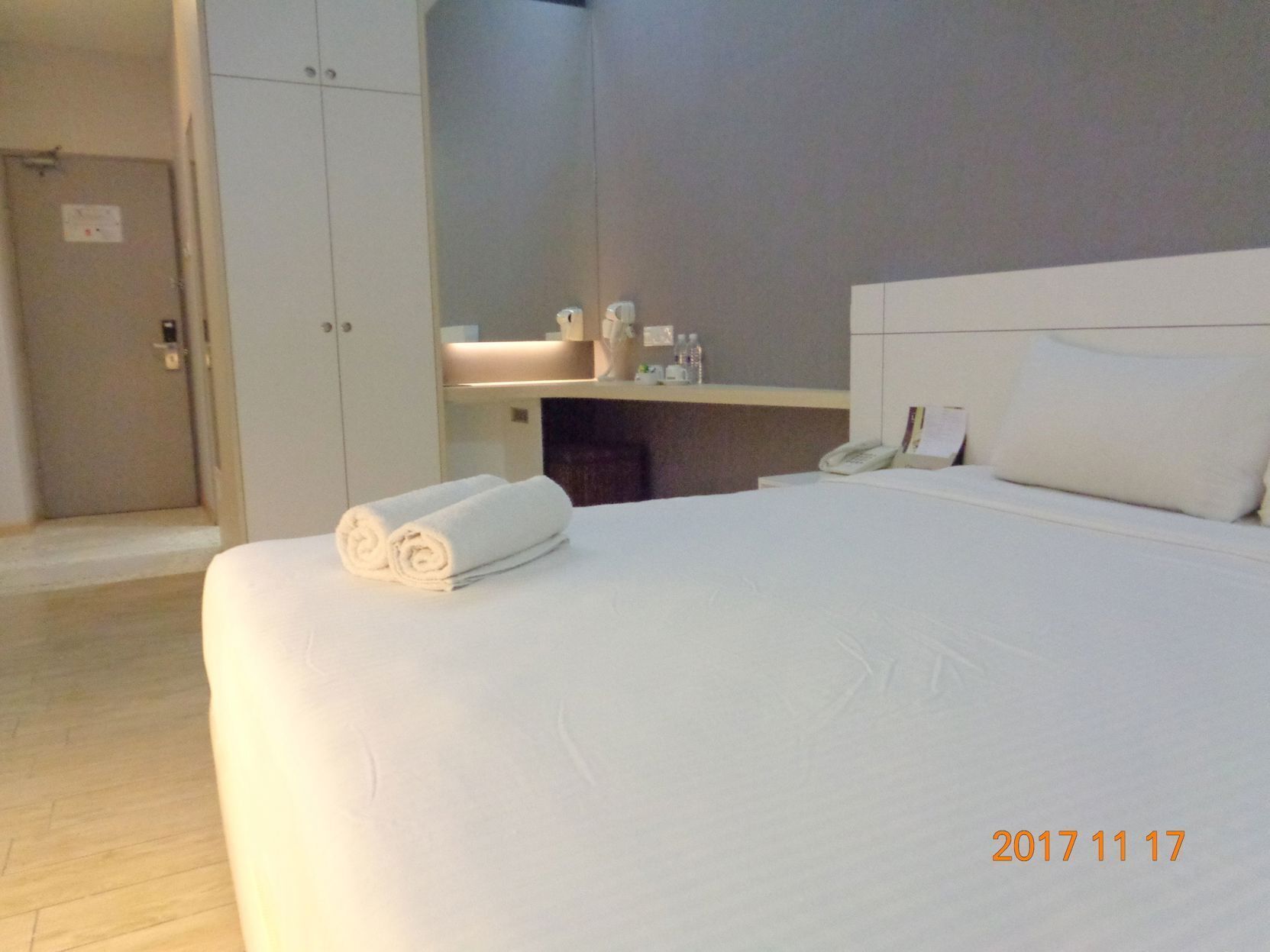 Desk, iron/ironing board, bed sheets