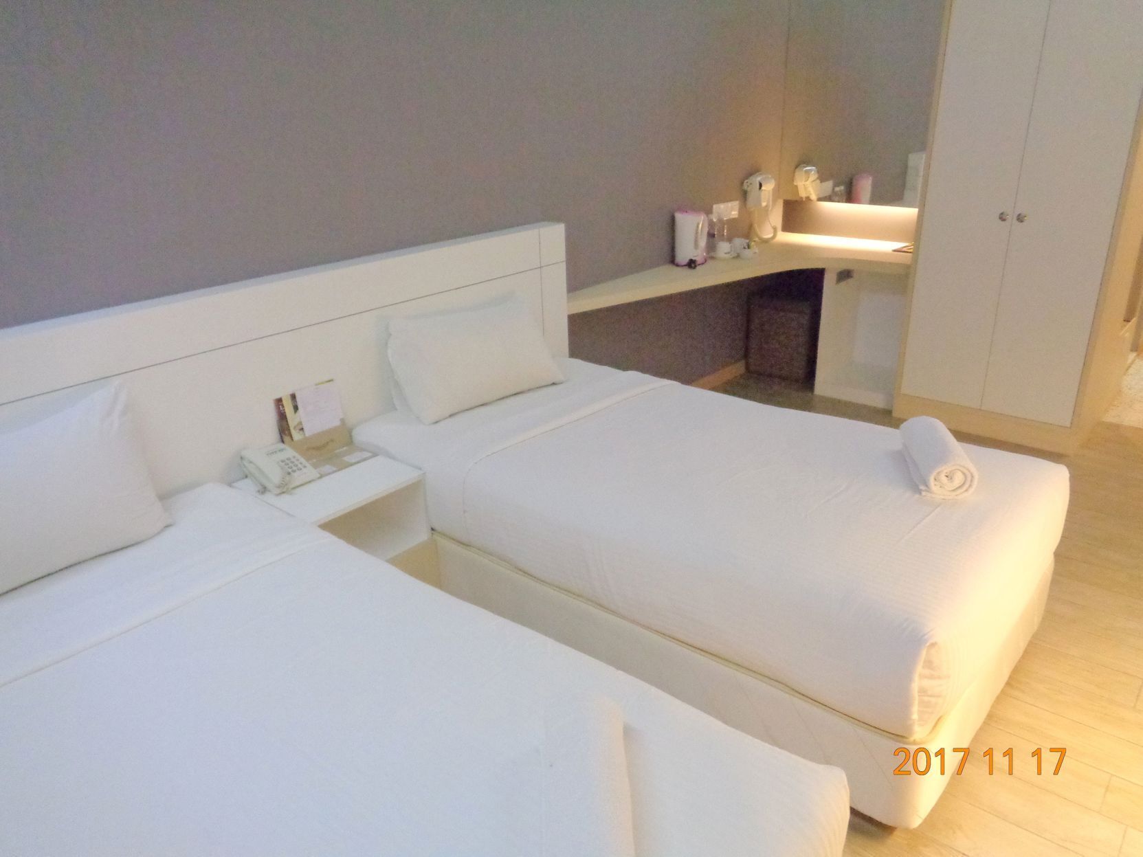 Desk, iron/ironing board, bed sheets