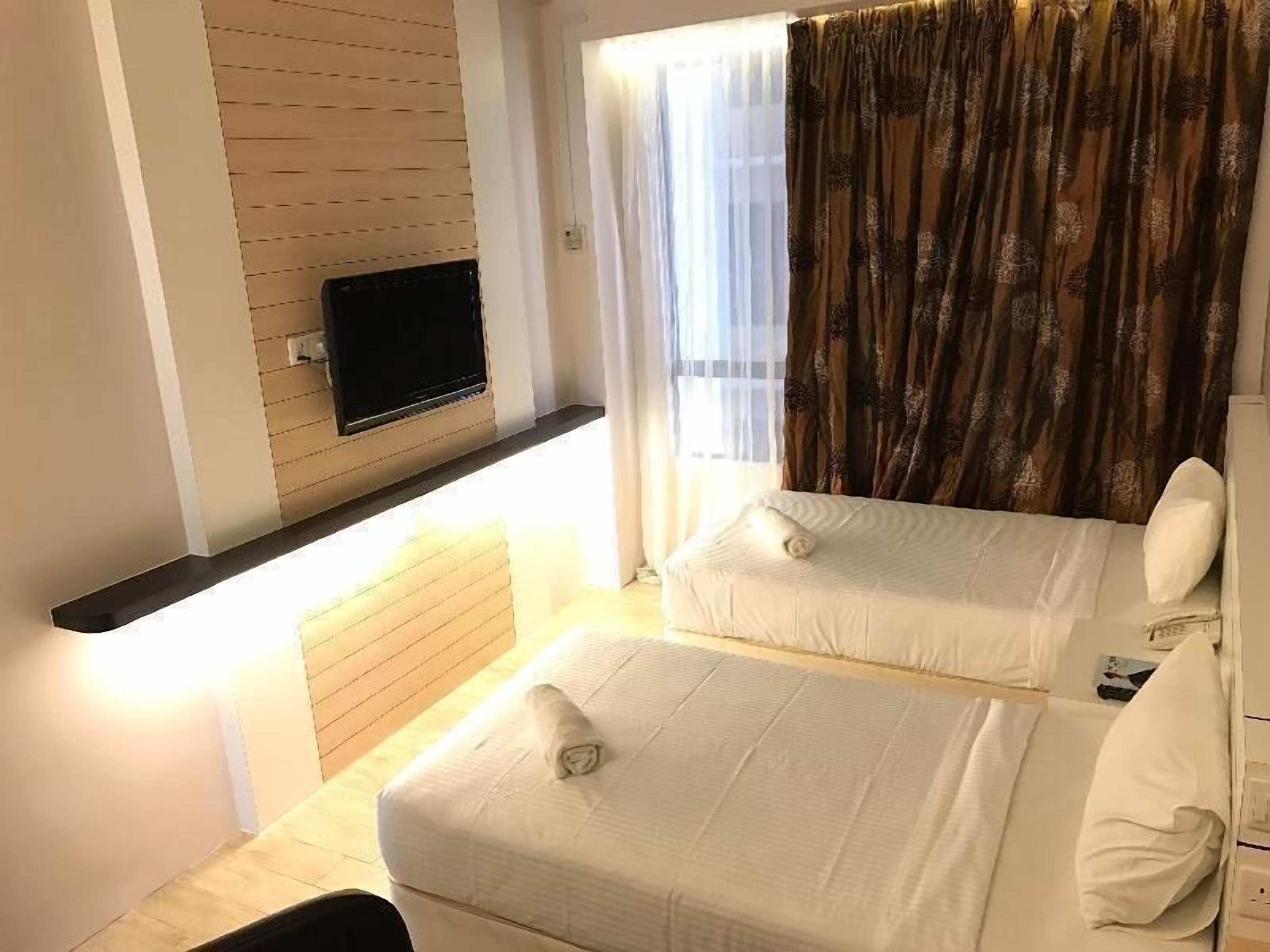 Desk, iron/ironing board, bed sheets