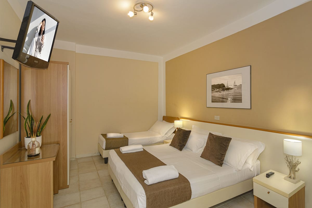 Basic Triple Room, Courtyard View | 2 bedrooms, down duvets, minibar, in-room safe