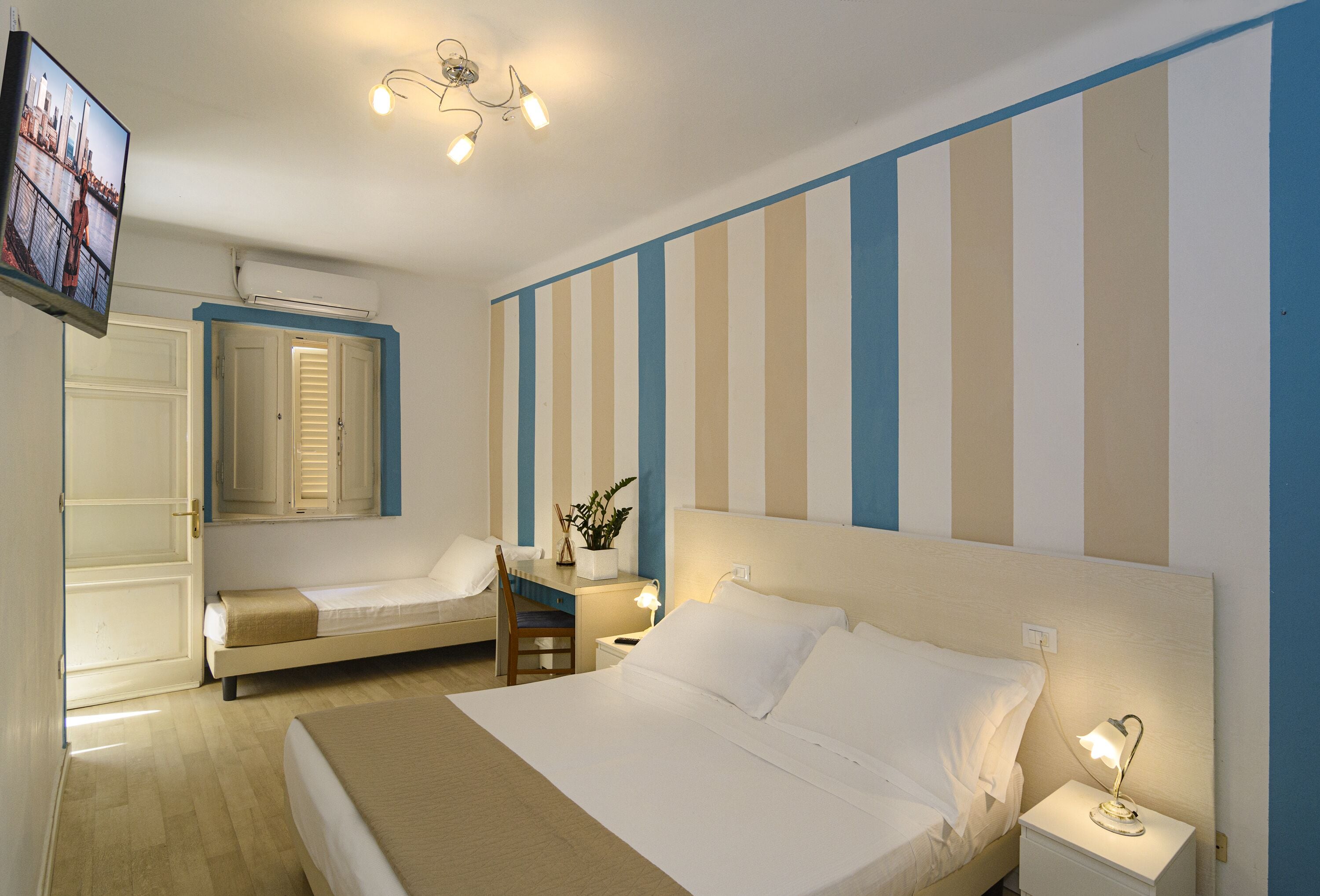 basic triple room, courtyard view | 2 bedrooms, down duvets, minibar, in-room safe