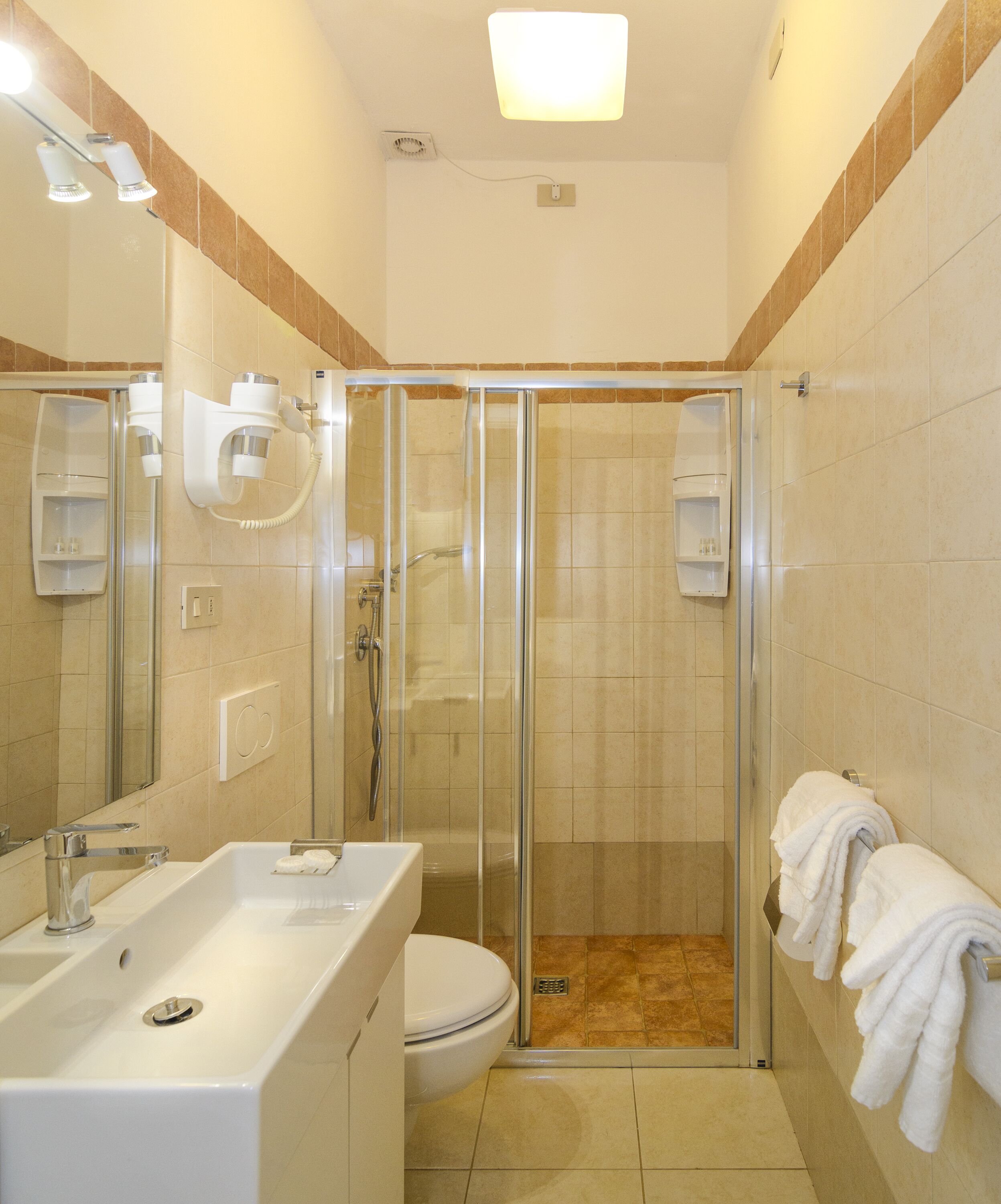 basic quadruple room, courtyard view, courtyard area | bathroom | shower, hair dryer, bidet, soap