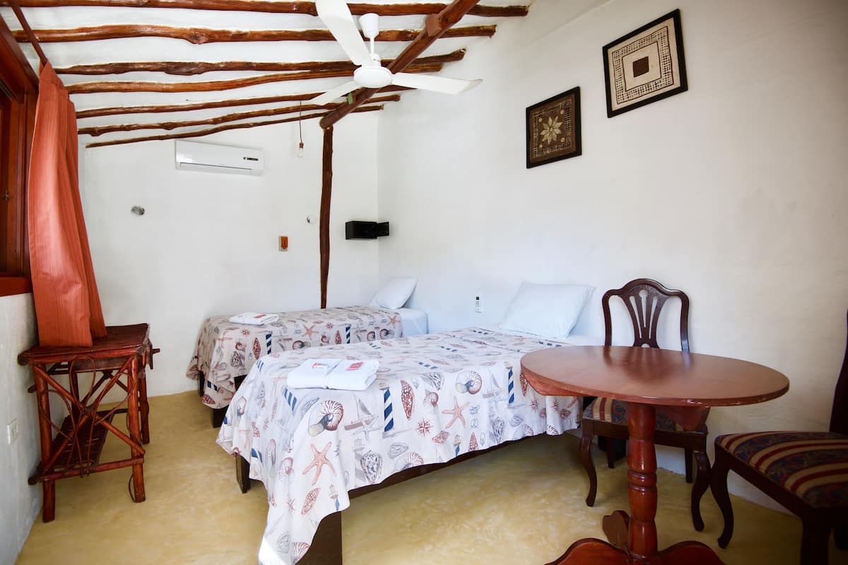Economy Twin Room, Private Bathroom (Exterior) | In-room safe, bed sheets