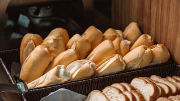 A basket of baguettes and sliced bread.