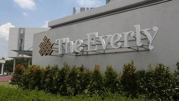 A modern building with a sign that reads "The Everly".