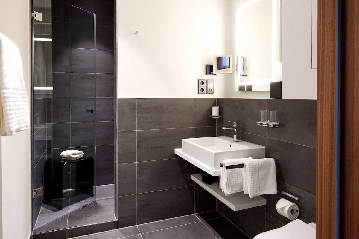 hair dryer, slippers, towels, soap