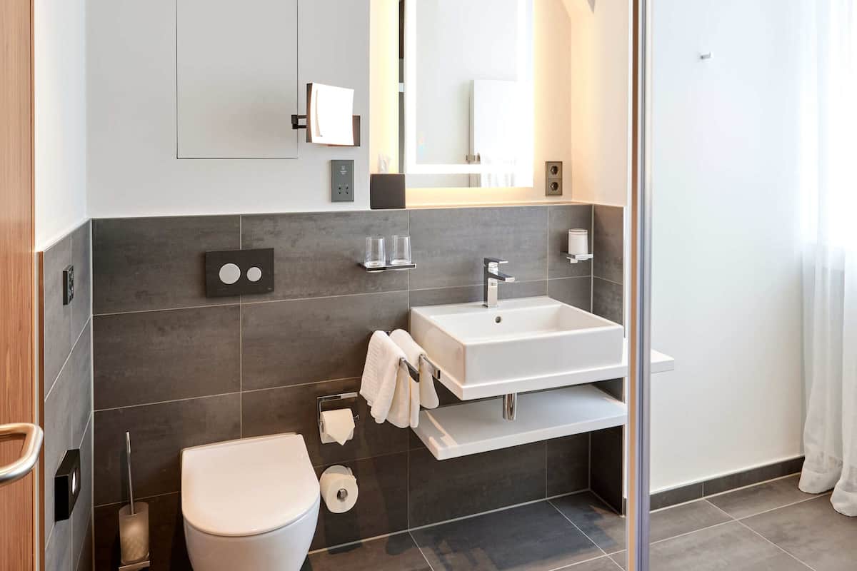 hair dryer, slippers, towels, soap