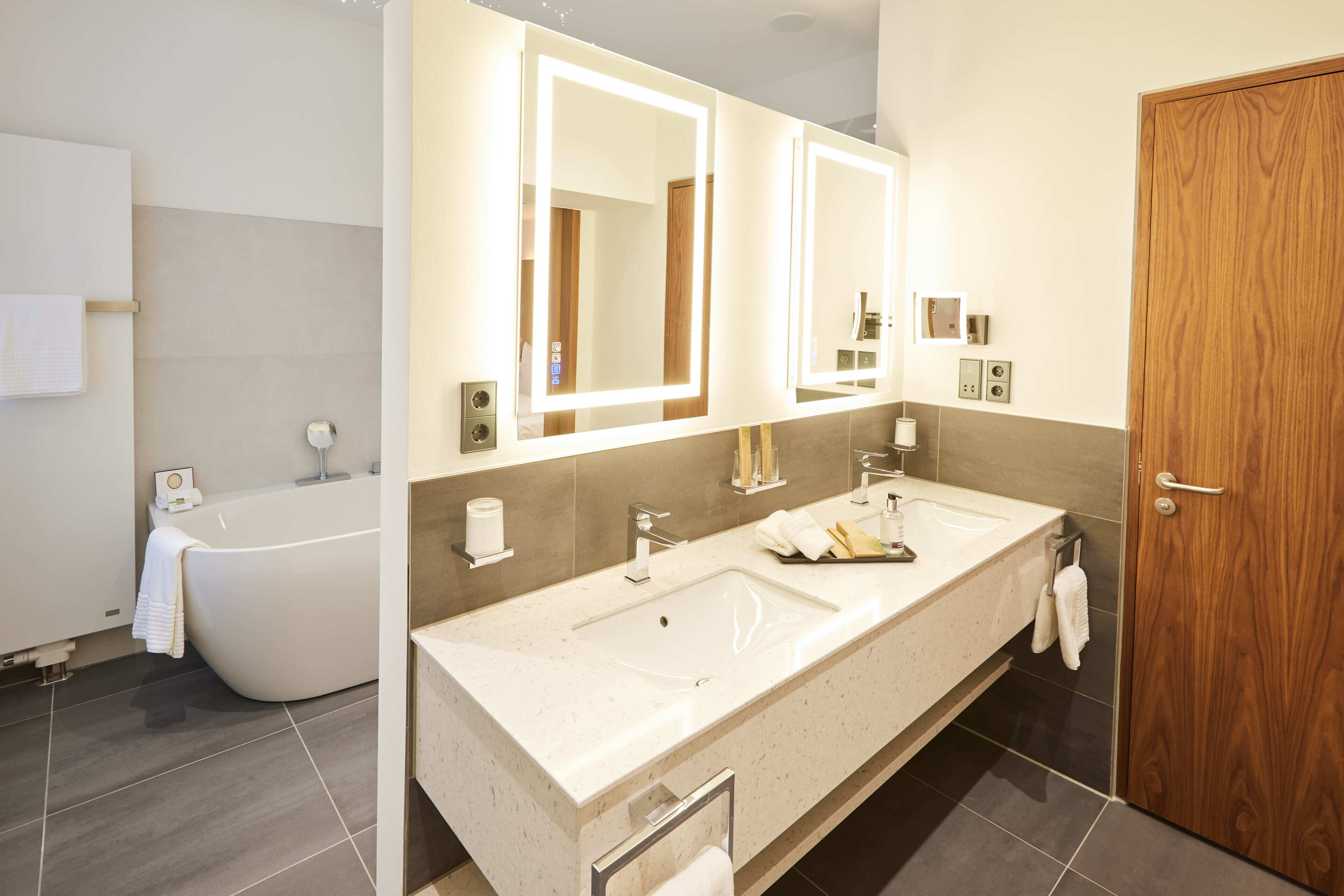 suite | bathroom | hair dryer, slippers, towels, soap