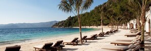 Private beach, white sand, sun loungers, beach umbrellas