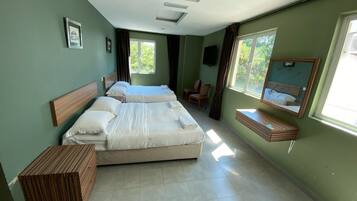 Family Room, Sea View | Desk, iron/ironing board, free WiFi, bed sheets