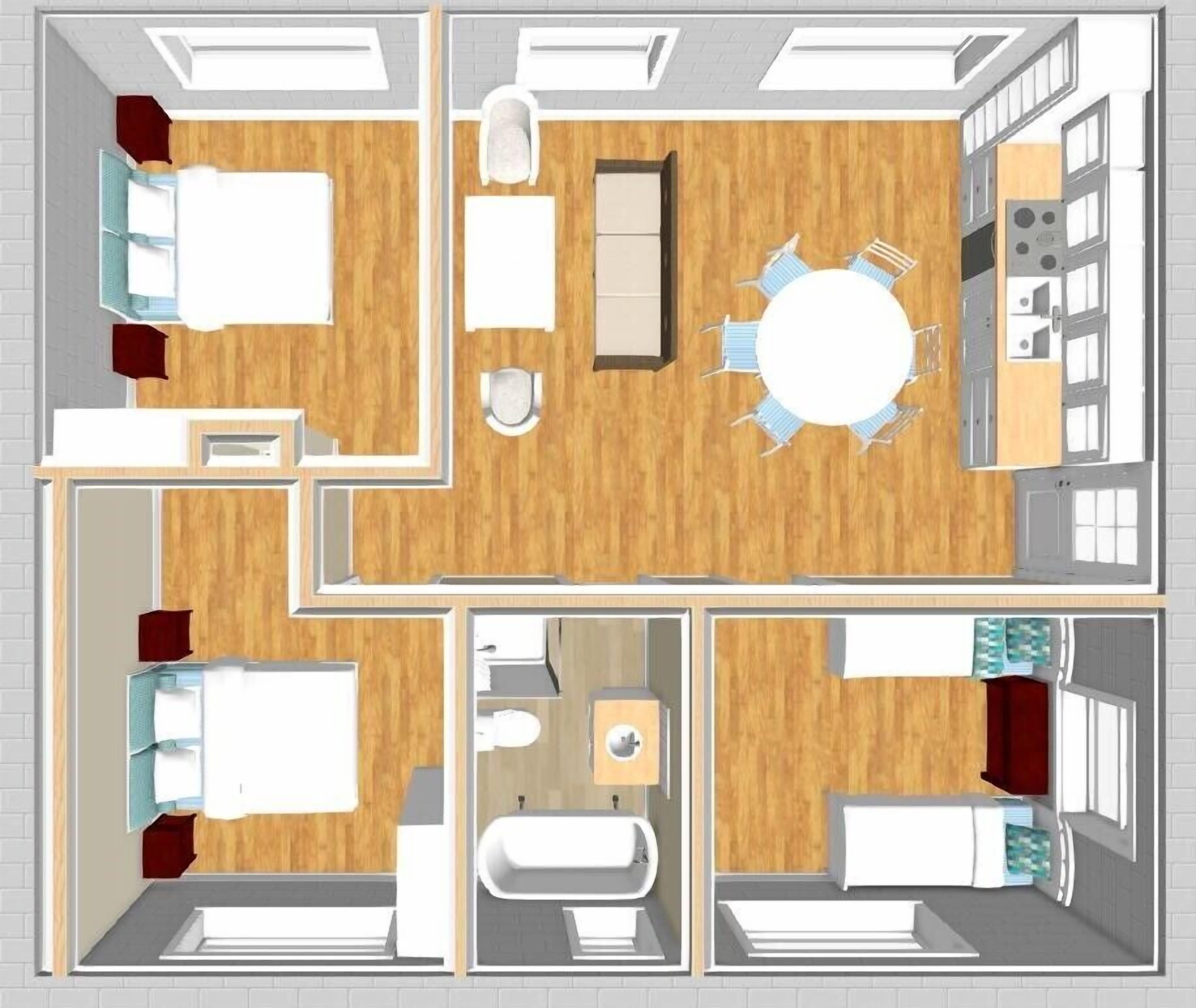 A hotel room layout with a bed, a desk, a chair, a small table, and a bathroom.