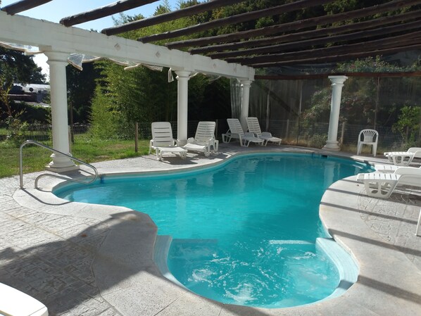 Seasonal outdoor pool, open 8:30 AM to 9:30 PM, pool loungers