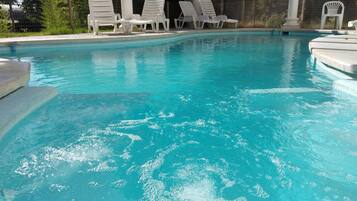 Seasonal outdoor pool, open 8:30 AM to 9:30 PM, pool loungers