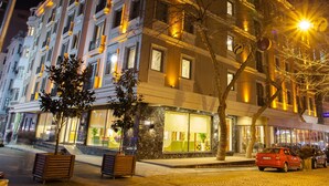 A multi-story hotel with a classic architectural style, featuring balconies and large windows. - The Parma Hotel Taksim (Istanbul)