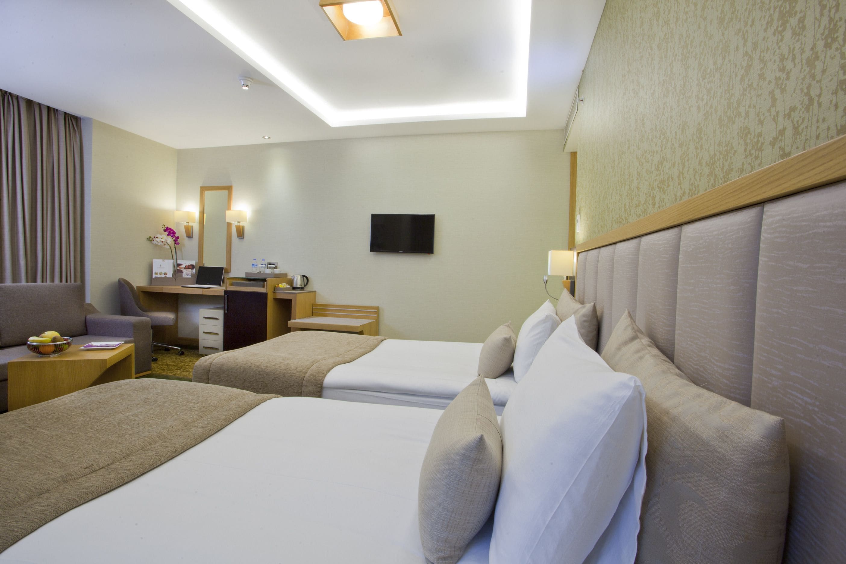 deluxe room | premium bedding, minibar, in-room safe, desk