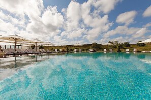 Indoor pool, outdoor pool, pool umbrellas, sun loungers