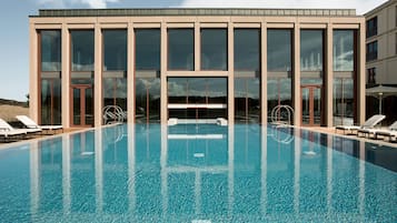 Indoor pool, outdoor pool, pool umbrellas, pool loungers