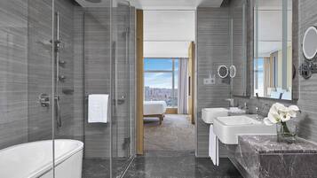 Club Executive Suite | Bathroom | Separate tub and shower, rainfall showerhead, designer toiletries
