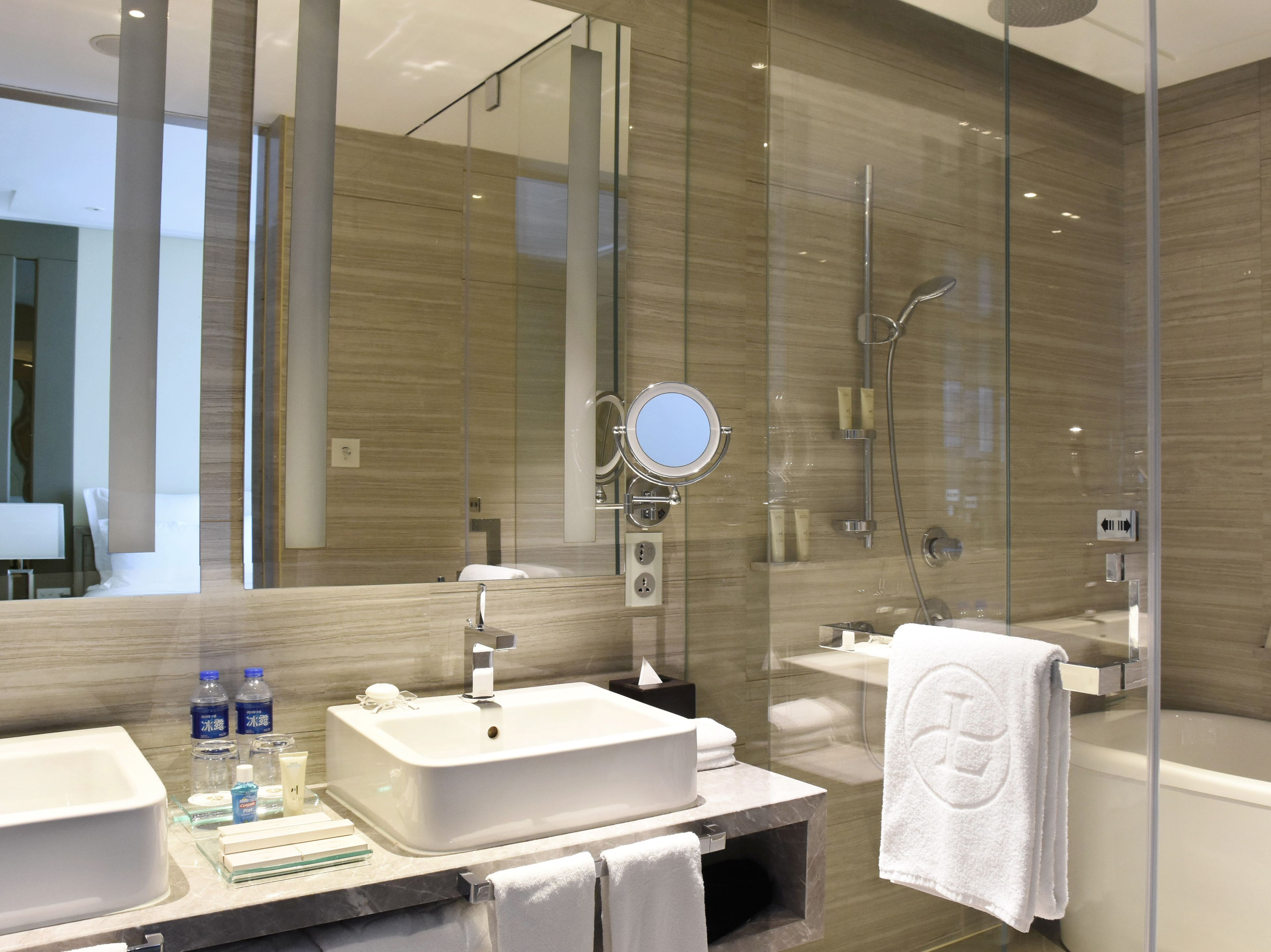 separate bathtub and shower, rainfall showerhead, designer toiletries