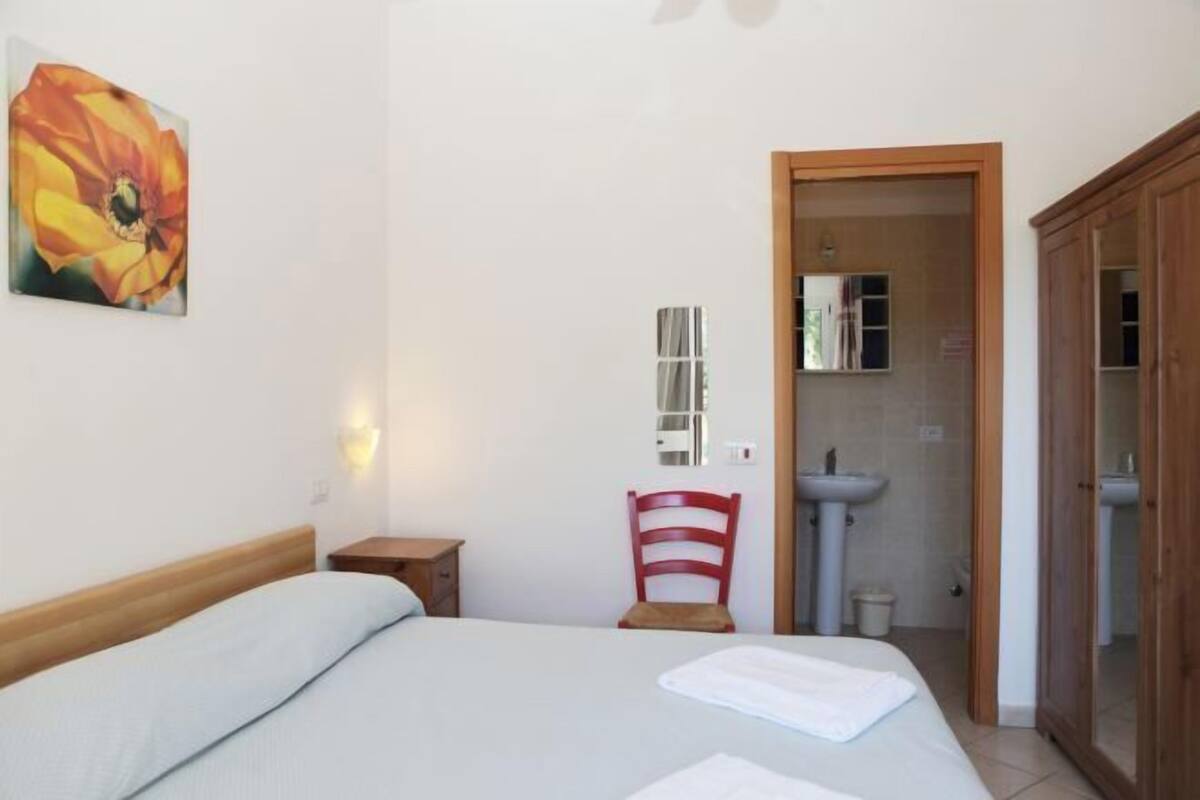 Minibar, desk, bed sheets