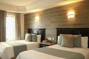 Double Room | Minibar, in-room safe, desk, iron/ironing board