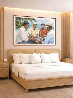 Ein Schlafzimmer mit einem Bett, einem Nachttisch, einem Holzboden und einem gerahmten Bild an der Wand.