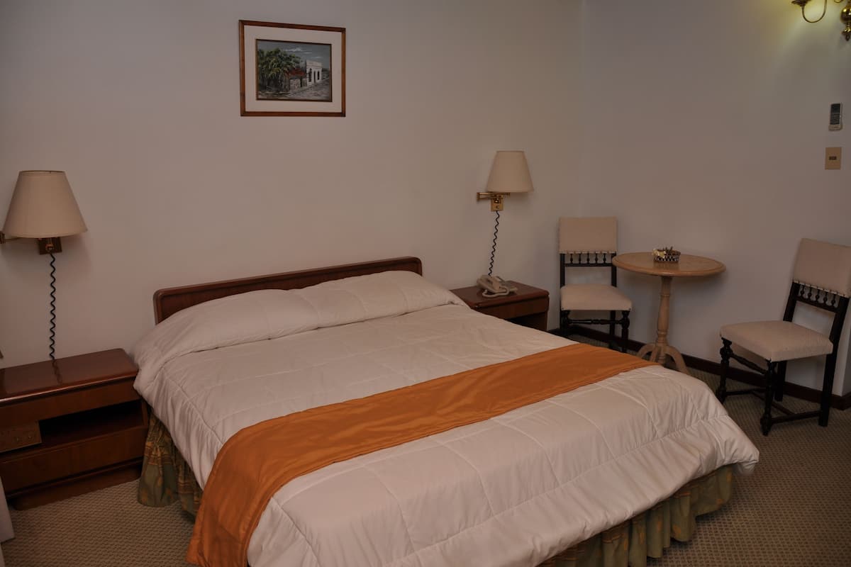 Double Room | Minibar, in-room safe, desk, blackout curtains