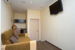 Studio, Jetted Tub | Living area | TV - Sunday Apart Hotel (Kyiv)