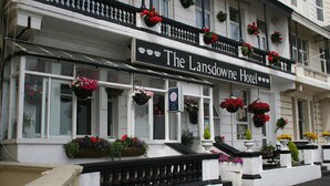 The Lansdowne Hotel with a traditional facade, multiple windows, and flower boxes. - Lansdowne Hotel (Hastings)