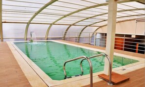 Indoor pool, open 11 AM to 6 PM, sun loungers