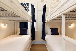 A room with bunk beds, white walls, and curtains. - Little Drifter Bondi Beach (Bondi Beach)