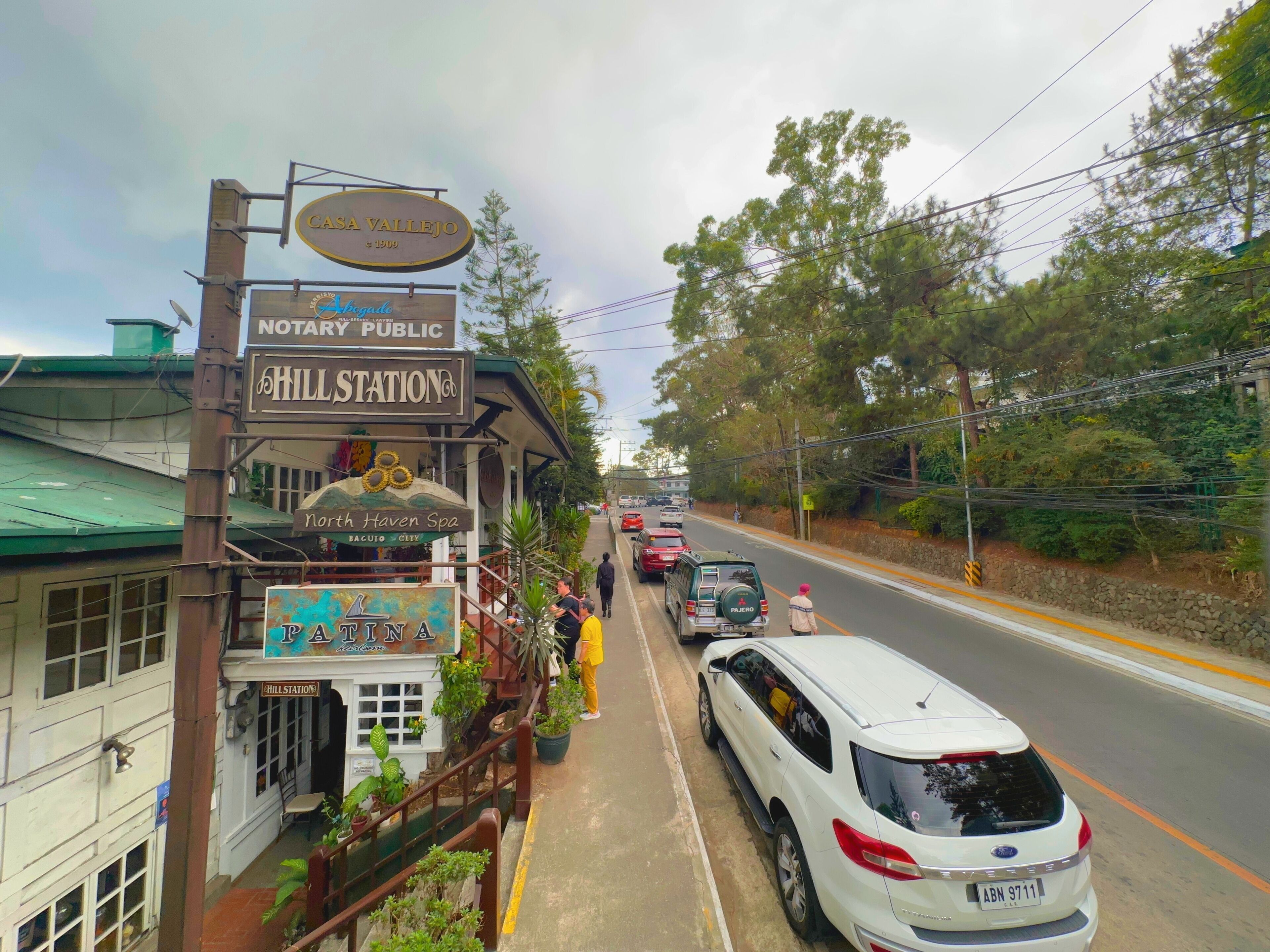 A building with signs for Casa Vallejo, Notary Public, and Hill Station.
