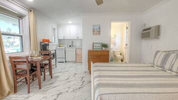 Classic Studio, 1 King Bed, Partial Ocean View | Individually decorated, individually furnished, desk, laptop workspace