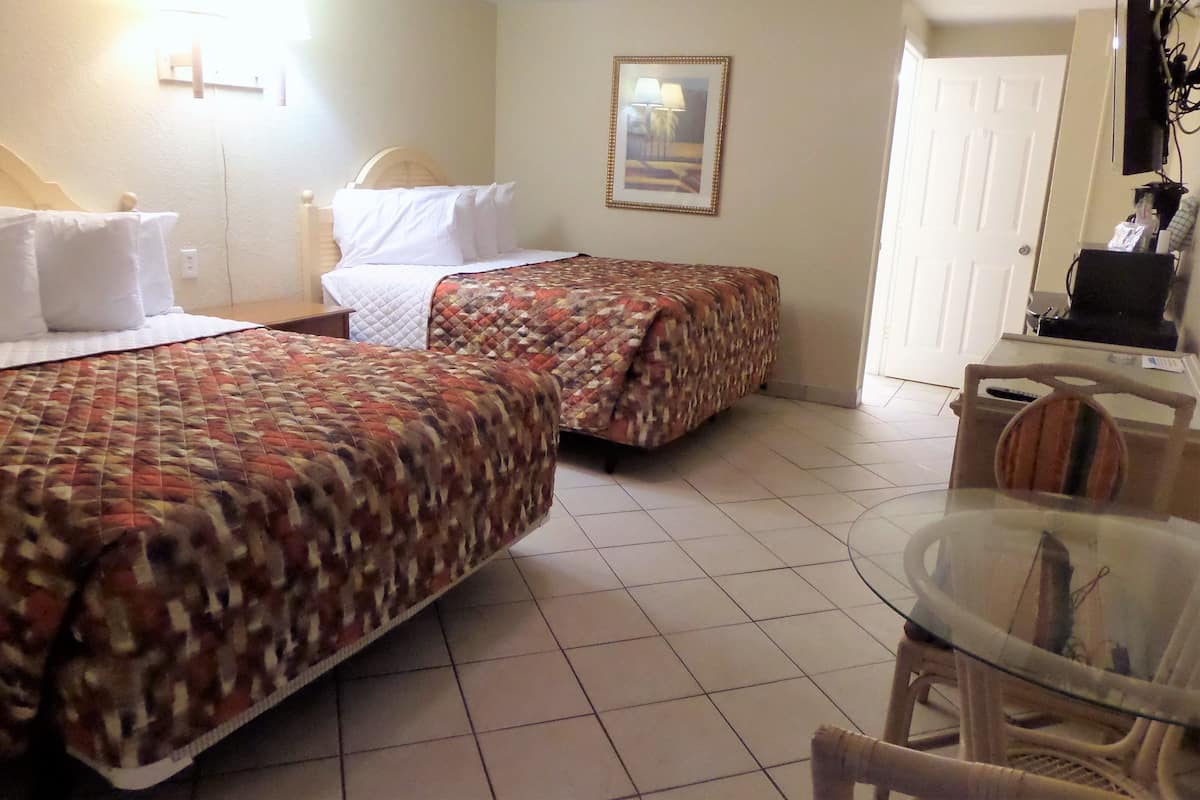 Economy Room, 2 Queen Beds, Accessible, Beachside | 1 bedroom, individually decorated, individually furnished, desk
