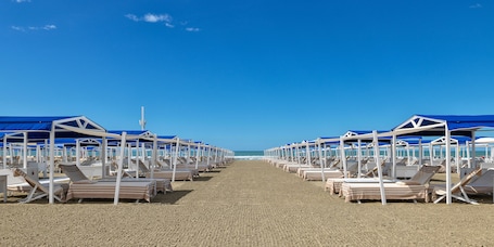Private beach nearby, beach cabanas, sun loungers, beach towels. Augustus Hotel & Resort