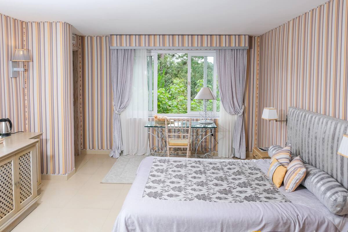 suite, garden view | 1 bedroom, premium bedding, minibar, individually decorated