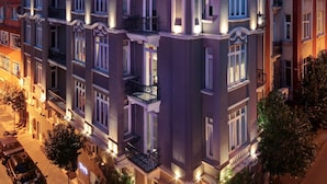 A multi-story building with balconies and large windows, featuring a modern architectural style. - The Central House Istanbul Taksim (Istanbul)