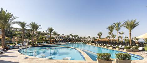 6 outdoor pools, open 8:00 AM to 5:30 PM, pool umbrellas, pool loungers