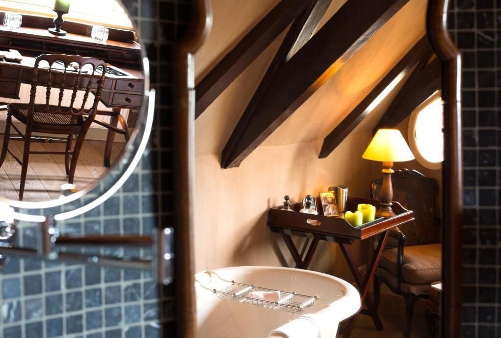 suite, 1 king bed | bathroom | designer toiletries, hair dryer, slippers, towels