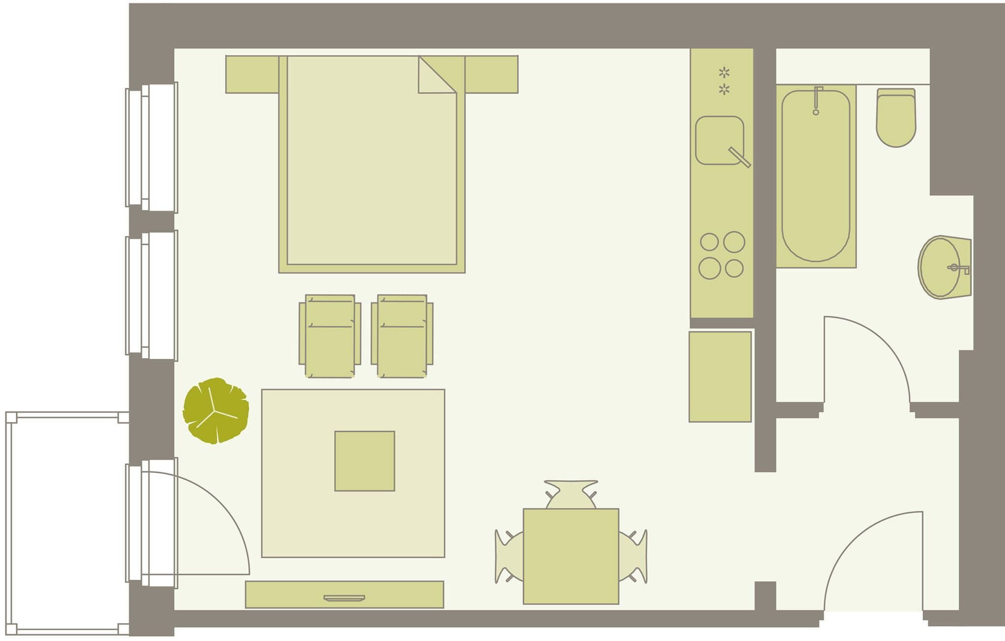 A floor plan of a hotel room with a bed, a desk, a chair, a small table, a sofa, a bathroom with a bathtub, a toilet, and a sink.