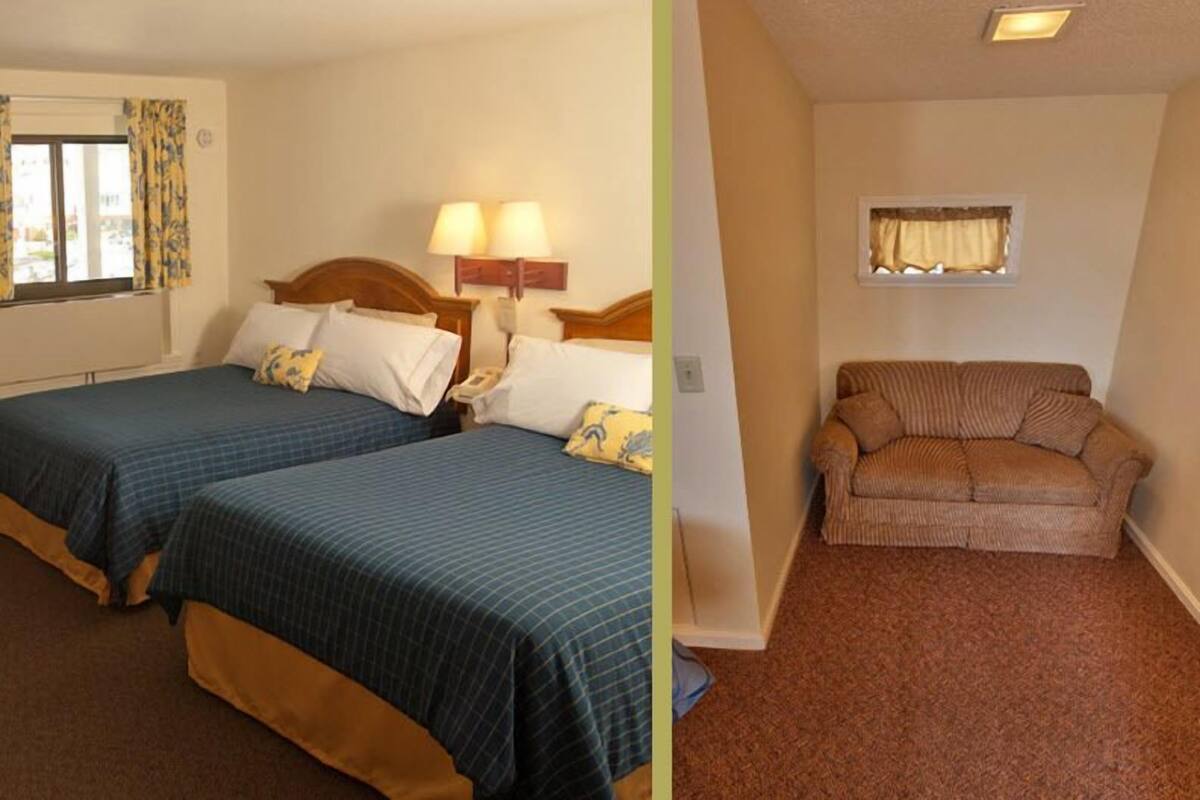 A hotel room with two beds, a sofa, a window with curtains, and a lamp.