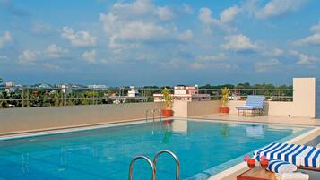 Indoor pool, open 6:00 AM to 6:30 PM, pool loungers