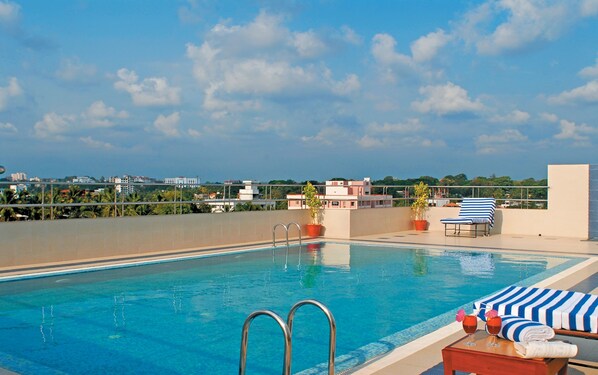 Indoor pool, open 6:00 AM to 6:30 PM, pool loungers