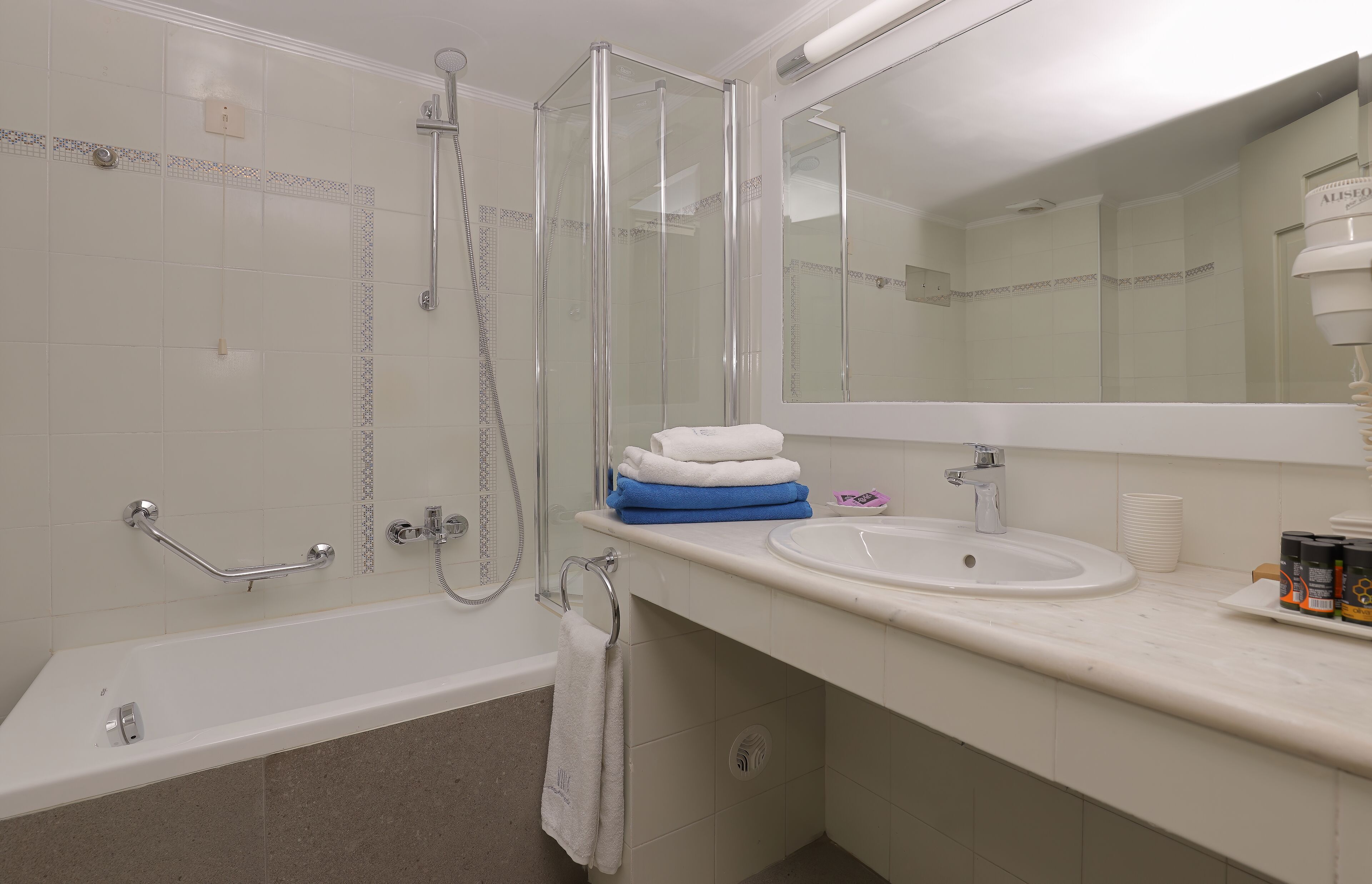 bathtub, free toiletries, hair dryer, towels