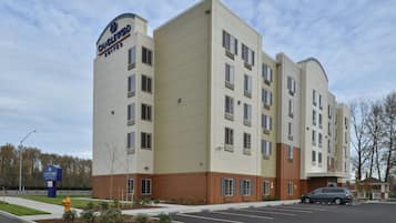 A multi-story hotel with a prominent signage for Candlewood Suites.