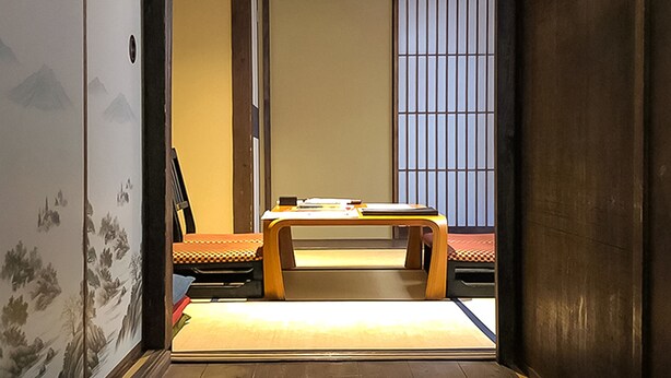 A traditional Japanese room with tatami flooring, a low wooden table, and a shoji screen. - Kyoto Miyabi Inn -Only one group a day- (Kyoto)