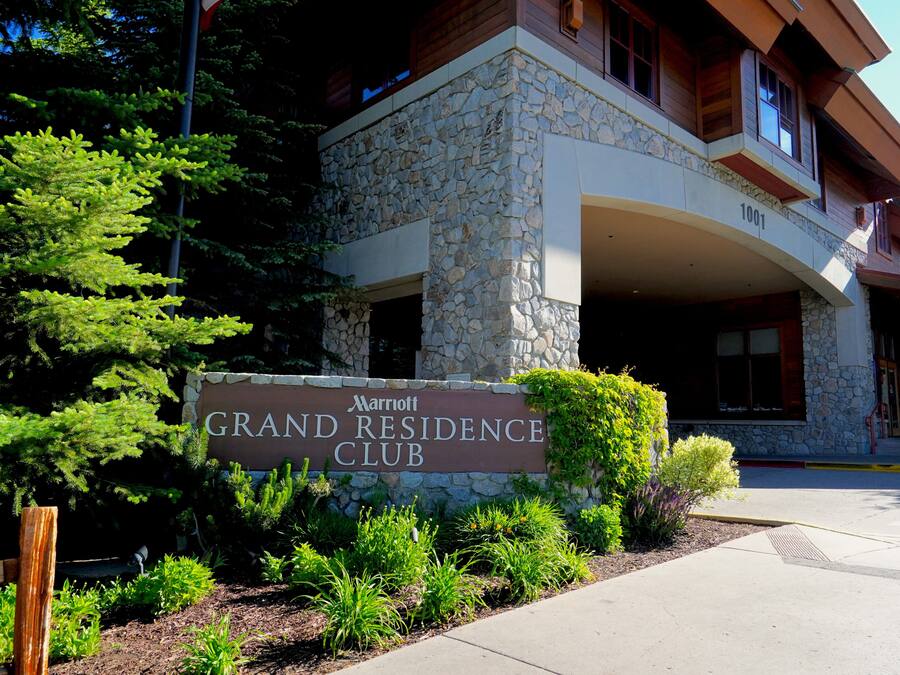 A stone building with a sign reading "Marriott Grand Residence Club."